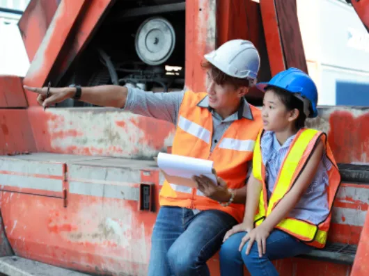 A construction worker telling a girl about his job